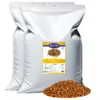 Two large white bags of birdseed with a label and a pile of birdseed in front. Produktbild-Vorschau