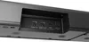 A close-up view of the rear ports of a black soundbar. Voir les images du produit