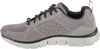 A side view of a gray athletic shoe. Voir les images du produit