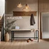 An entryway with a bench, coat rack, and decorative items. Náhled obrázku produktu
