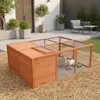 An outdoor wooden rabbit hutch with two rabbits inside, placed on straw in a garden setting. Anteprima dell’immagine prodotto