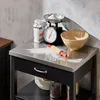 A kitchen cart with baking ingredients and tools on its surface. Produktbild-Vorschau