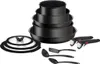 A set of black cookware and kitchen utensils is displayed against a white background. Anteprima dell’immagine prodotto