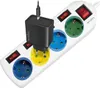 A white power strip with multiple outlets and switches, with a black USB charger plugged into one of the outlets. Náhled obrázku produktu