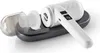 A handheld vacuum cleaner with accessories on a charging base. Voir les images du produit