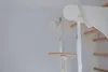 Close-up of a wooden swing plate attached to a white climbing structure. Podgląd zdjęcia produktu