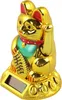 A golden lucky cat figurine with a solar panel on its base. Produktbild-Vorschau