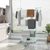 A laundry room with a washing machine, cabinets, and a drying rack filled with clothes and towels. Náhľad obrázku produktu