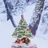 A Christmas tree ornament with figures at the base, set against a snowy forest backdrop. Náhľad obrázku produktu