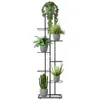 A black metal plant stand with multiple tiers holding various potted plants against a white background. Anteprima dell’immagine prodotto