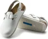 A pair of white Birkenstock Tokio clogs with a cork footbed and a Superlaufsohle sole, presented on a white background. Produktbild-Vorschau