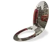 A toilet seat with a London-themed design, featuring a red double-decker bus and a red telephone booth. Produktbild-Vorschau