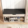 A shoe cabinet with a padded seat, displaying various shoes on its shelves. Podgląd zdjęcia produktu