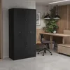 An office or workspace setting with a black filing cabinet, desk, chair, and plants. Voir les images du produit