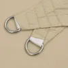 Close-up of two D-rings attached to a beige fabric. Anteprima dell’immagine prodotto