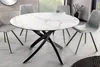 A dining room setting with a round marble-top table and chairs. Produktbild-Vorschau