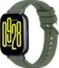 A close-up studio shot of a smartwatch with a dark green strap.