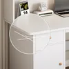 A close-up view of the rounded corner of a white desk, highlighting its smooth finish and subtle design elements. Podgląd zdjęcia produktu