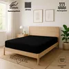 A black fitted sheet is displayed on a wooden bed frame in a bedroom setting. Produktbild-Vorschau