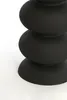 A close-up, studio shot of a black, stacked column object against a white background. Produktbild-Vorschau