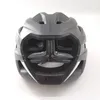 A close-up, front-facing view of a gray bicycle helmet against a white background. Produktbild-Vorschau