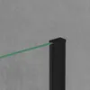 A close-up view of a black post and a green glass panel, likely part of a shower enclosure, against a textured gray wall. Produktbild-Vorschau