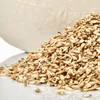 A pile of grains in front of a sand-colored object. Náhľad obrázku produktu