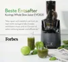A Kuvings Whole Slow Juicer EVO820 is shown with apples, juice, and a newspaper. Podgląd zdjęcia produktu