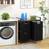 A laundry room scene with a washing machine and a multi-compartment laundry sorter. Produktbild-Vorschau
