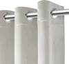 Close-up view of beige velour curtains with grommets on a silver curtain rod. Produktbild-Vorschau