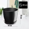 A black plastic plant pot with a saucer, shown on a light gray and white background with measurement indicators. Podgląd zdjęcia produktu