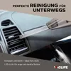 A hand vacuum cleaner is being used to clean the interior of a car, specifically the air vents. Produktbild-Vorschau