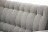 A close-up view of the tufted upholstery of a sofa. Produktbild-Vorschau