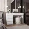 A modern bedroom with a white vanity desk and a laptop. Produktbild-Vorschau