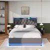 A modern bedroom with a grey upholstered bed featuring LED lighting and integrated charging. Produktbild-Vorschau