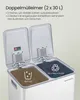 A white double trash can with its lids open, showing two compartments for waste separation. Text overlays describe the product's features. Produktbild-Vorschau
