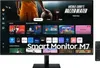 A Samsung Smart Monitor M7 is displayed with a basketball-themed advertisement on its screen, showcasing various apps and content. A remote control is placed to the right of the monitor. Produktbild-Vorschau