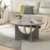 A living room scene with a couch, coffee table, and plant. Produktbild-Vorschau