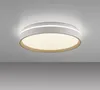 A modern, round LED ceiling light with a white frame and a beige accent ring, mounted on a white ceiling. Anteprima dell’immagine prodotto