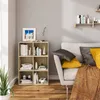 A living room scene with a bookshelf and sofa. Produktbild-Vorschau