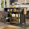 A kitchen island cart is shown in a well-lit kitchen setting. Podgląd zdjęcia produktu