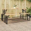 An outdoor patio scene with wooden picnic tables and benches set against a wooden fence. Podgląd zdjęcia produktu