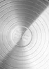 The underside of a metal pot with concentric circles and embossed text. Produktbild-Vorschau