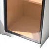 A close-up view of the bottom corner of a white cabinet with a glass door, revealing a wooden interior. Náhled obrázku produktu