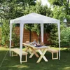 A white party tent set up in a garden with a wooden picnic table and benches. Anteprima dell’immagine prodotto