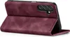 A burgundy flip case for a smartphone is shown standing open, revealing the phone's camera module. Produktbild-Vorschau