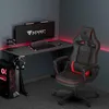 A gaming chair and desk setup in a room with red LED lighting. Voir les images du produit