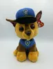 A plush toy dog wearing a police uniform and hat. Voir les images du produit