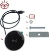 A flat lay of a wireless charger and its accessories, including a USB-C cable, a bolt, a nut, a metal plate, and an instruction manual icon. Produktbild-Vorschau