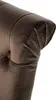 A close-up view of the tufted armrest of a brown velvet chair. Voir les images du produit